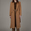  Tailored camel and black wool coat with a double-breasted front, welt pockets, and a colorblock collar.